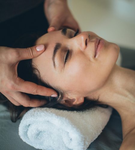 pexels-photo-3865496-3865496 Woman enjoying a soothing facial massage at a spa, eyes closed and relaxed.